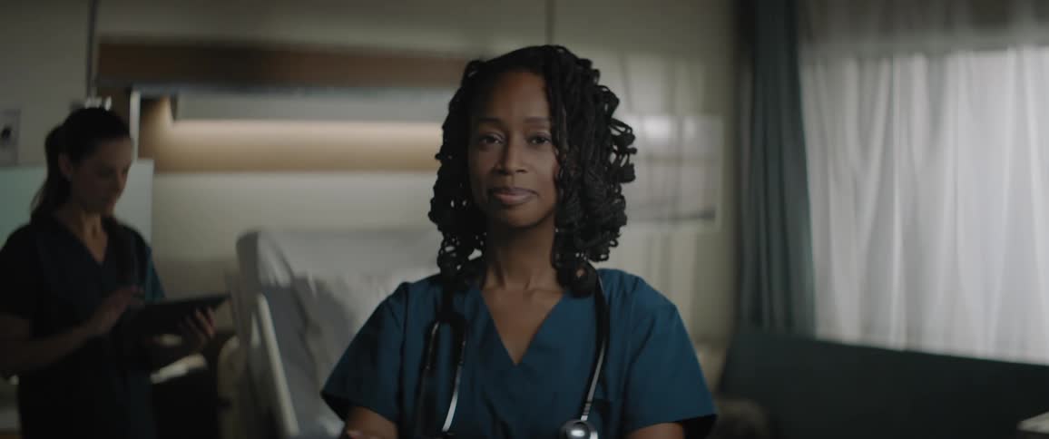 Nurses in a room with one of them using a tablet