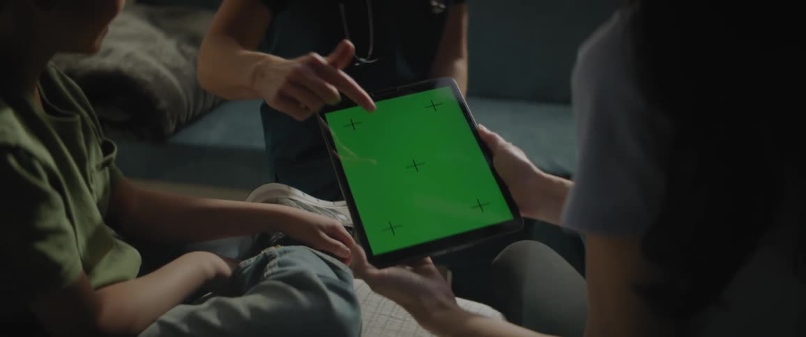 Hands of people using a tablet