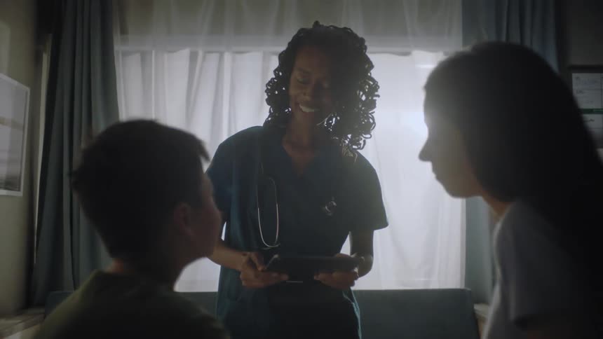 A doctor is speaking with a patient