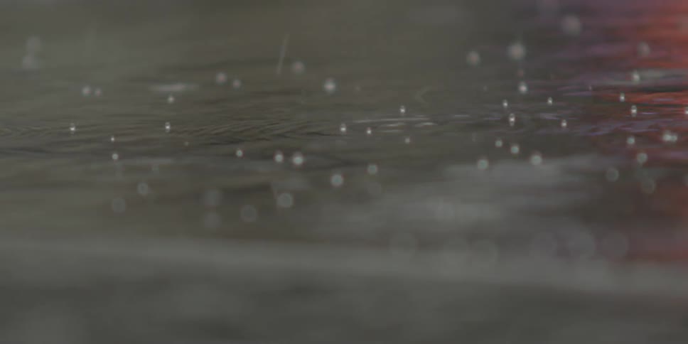 Rain hitting a body of water