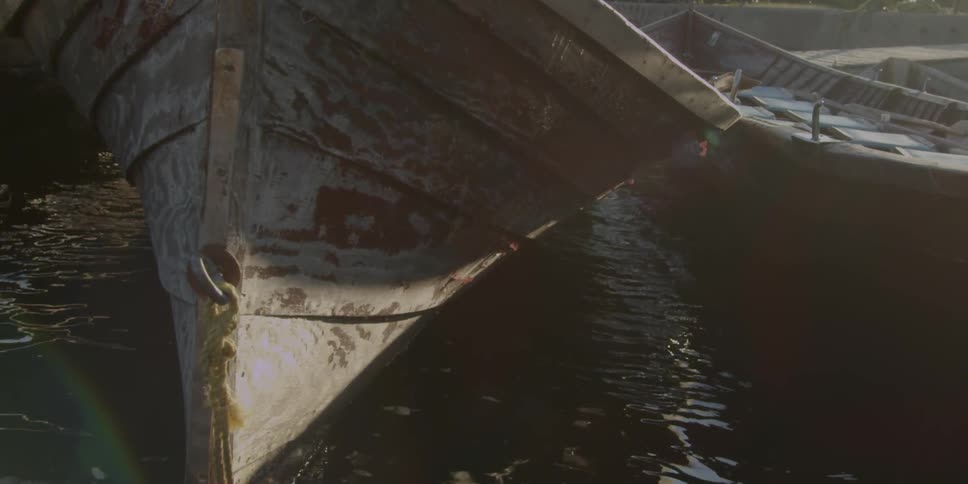 A boat floats on a lake