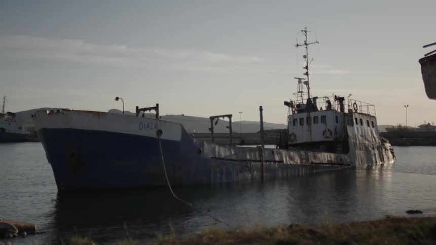 Tug boat near shore during the day