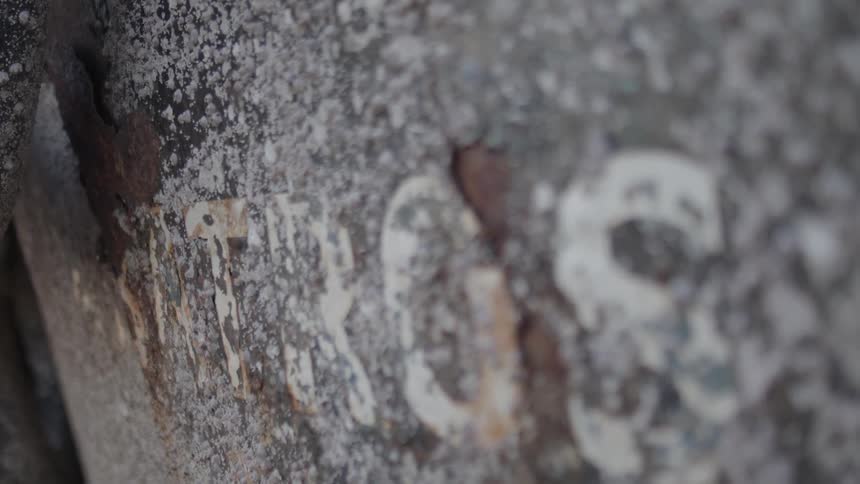 Extreme closeup of an old sign with writing