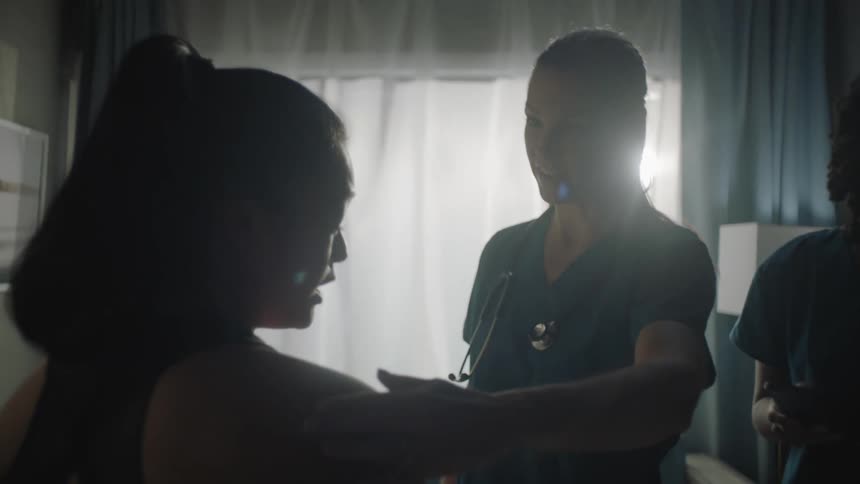 A doctor is examining a patient
