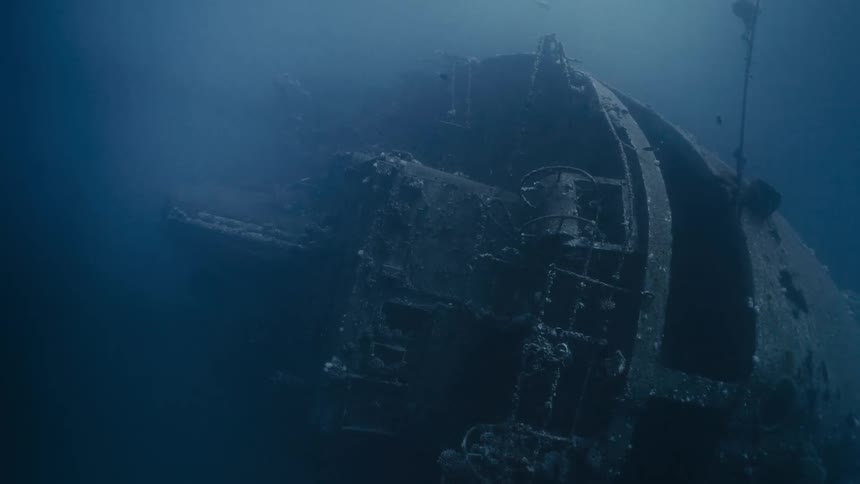 Ship at the bottom of the sea with mud and fish