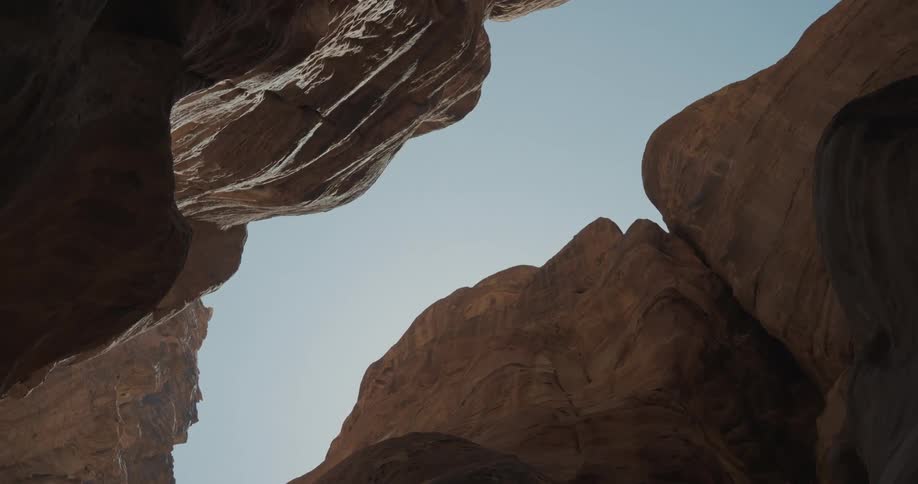 A view looking up into a valley between two rock formations