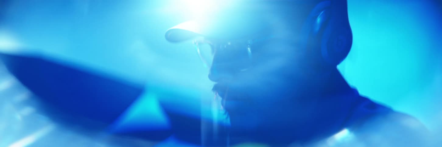 Portrait of a man with a reflective lens beneath him