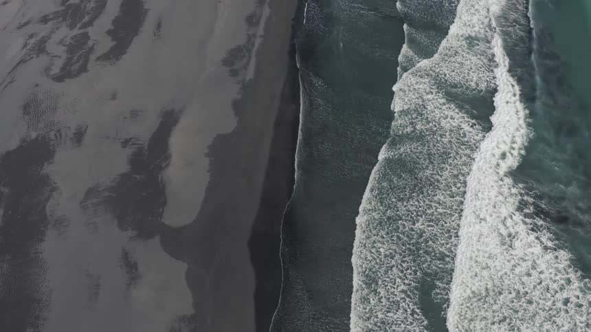 Aerial panorama of the beach with gray sand