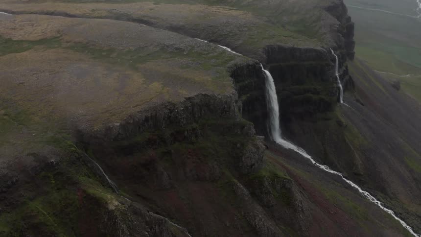 Aerial view of mountains with waterfalls between them