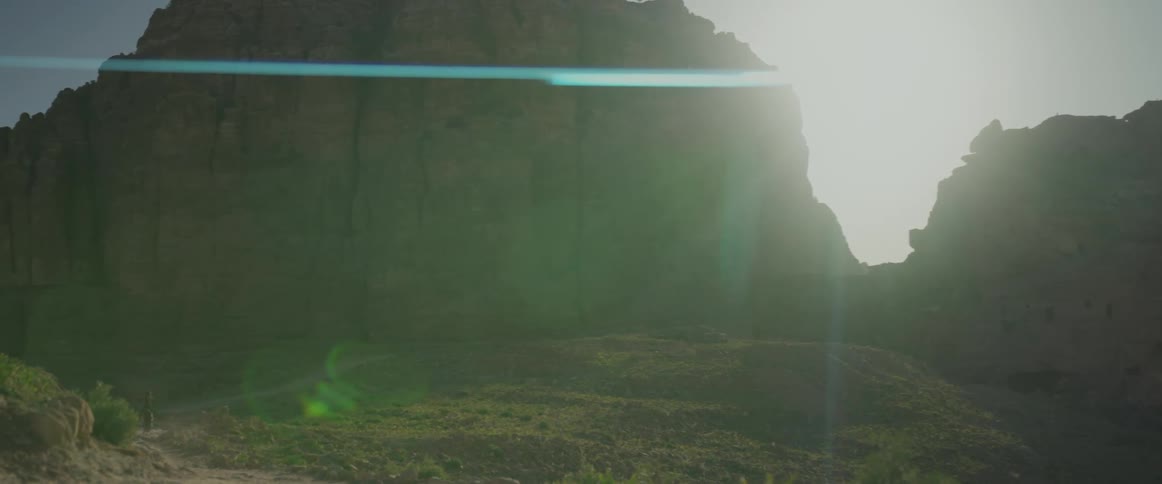View of canyons with the suns reflection