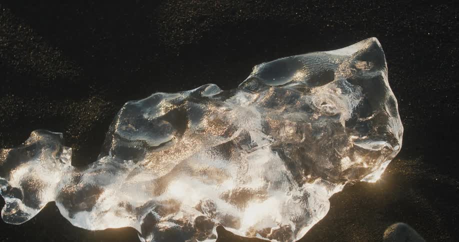 Sunlight reflects on the block of ice