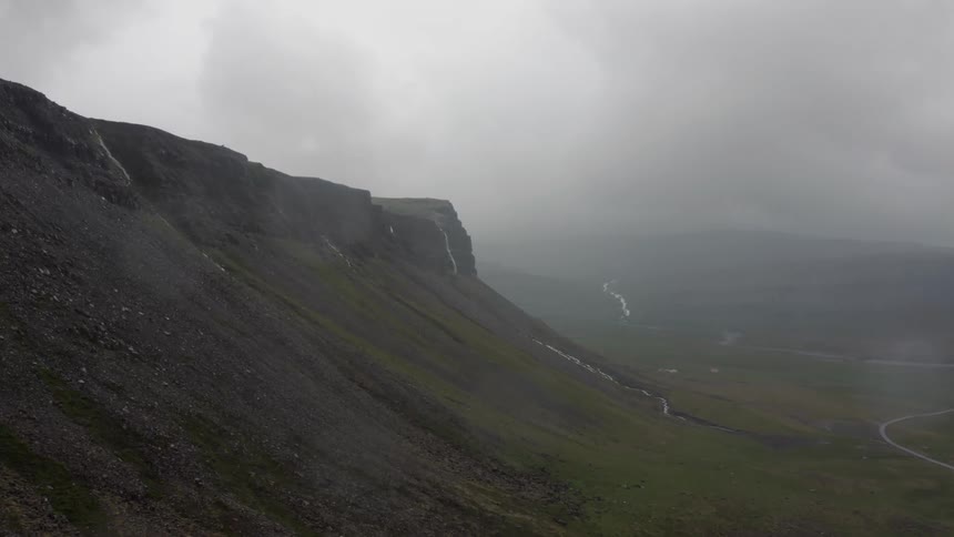 Aerial panorama of a mountain range on a cloudy day
