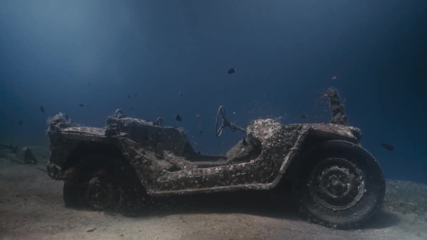 A small vehicle sunk at the bottom of the sea