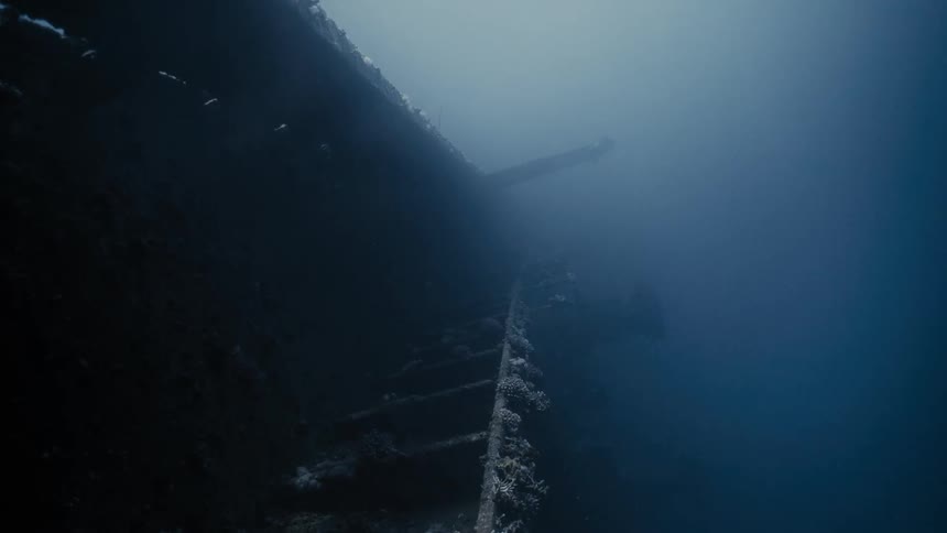 Remains of a ship that is sunk at the bottom of the blue sea