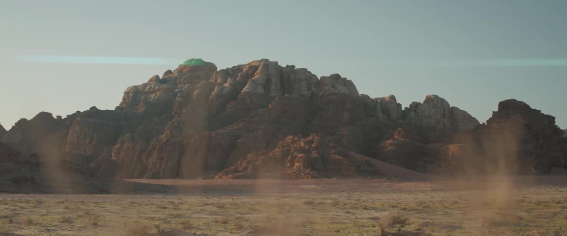 Rock formations in a red desert during the day