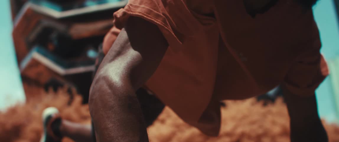Man with arms supported performing parkour