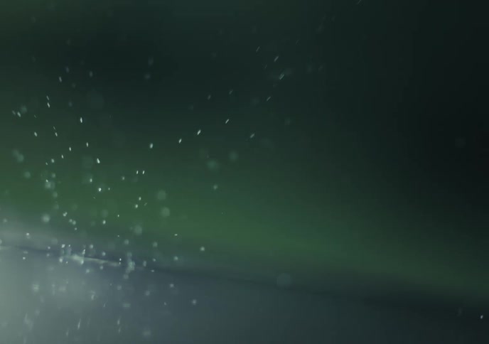 Drops falling into a shallow body of water making splashes