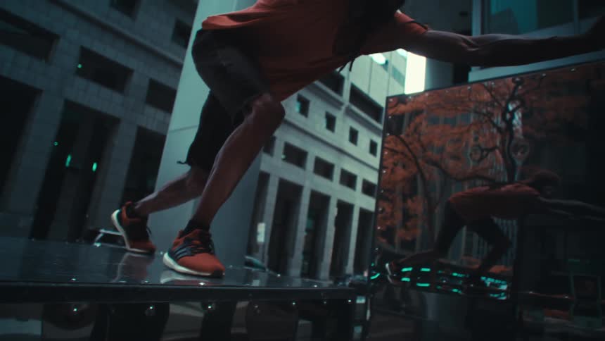 A man practicing parkour in city structures