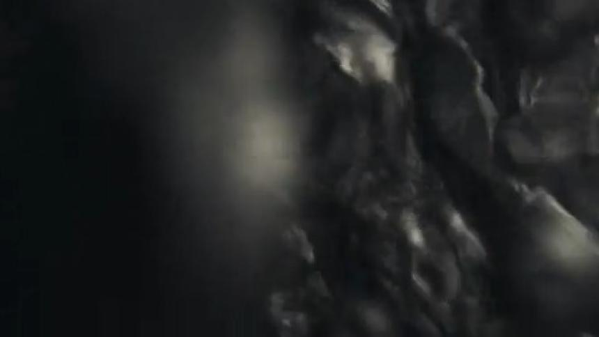 Fluid liquid art with floating black bubbles