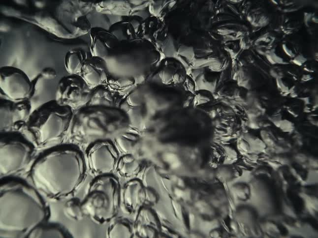 Bubbles in a bubbling black liquid