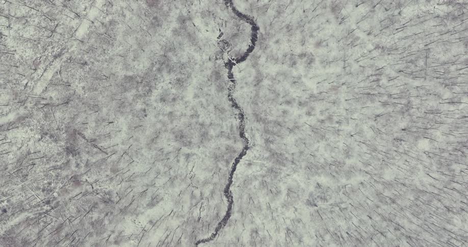 Closeup of a snowcovered rock on a rainy day