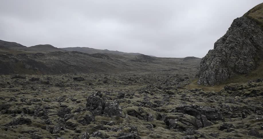 A brown, rocky landscape on a cloudy day