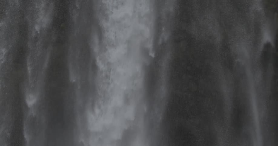 A waterfall pours water down below