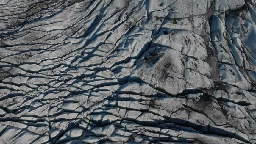 Aerial of a mountain with fissures in the rock