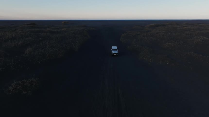 A truck is driving over the landscape