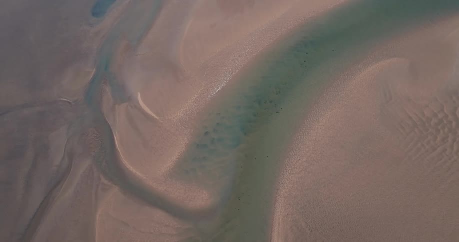 Top view of a river bed at the beach