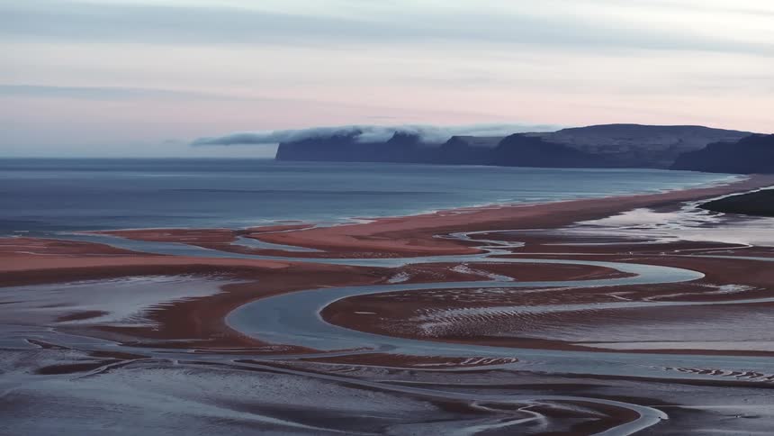 Panorama of the sea coastline and sand islands beneath the water