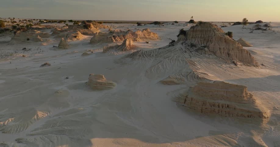 Panorama of ruins in the middle of the desert under a smoky evening sky
