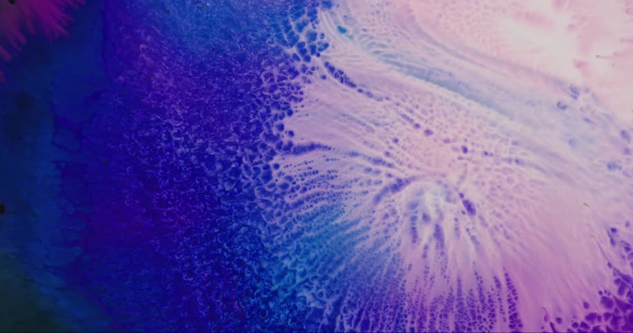 Extreme closeup view in blue and pink hues in abstract and slow motion