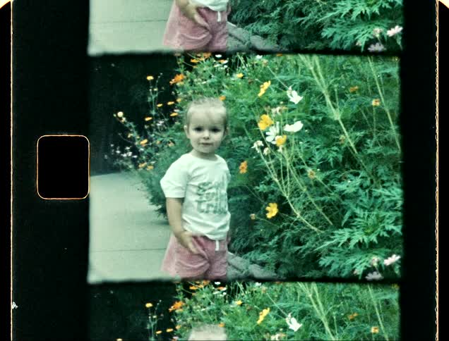 A child walks away from the flowers