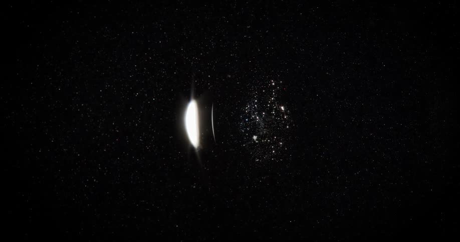 Extreme closeup of a bright abstract cosmos orbiting in slow motion