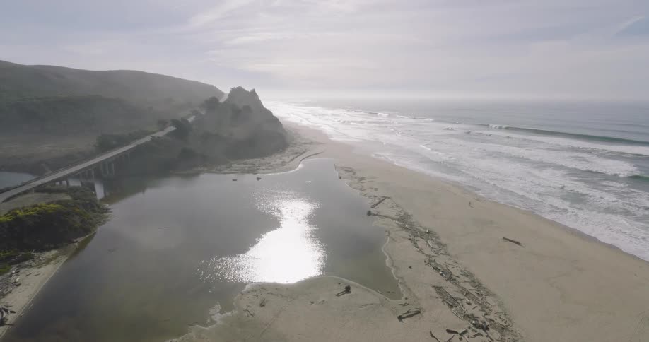 Aerial of the deserted beach at dawn
