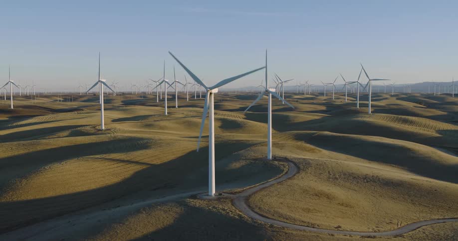 The hills are covered with windmills