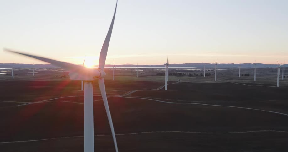 The windmills are spinning at sunrise