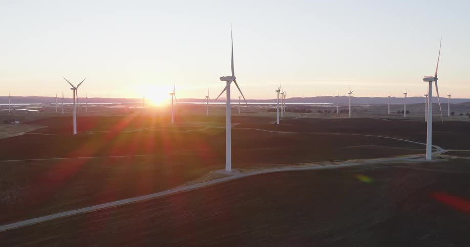 Aerial of a wind farm at sunset