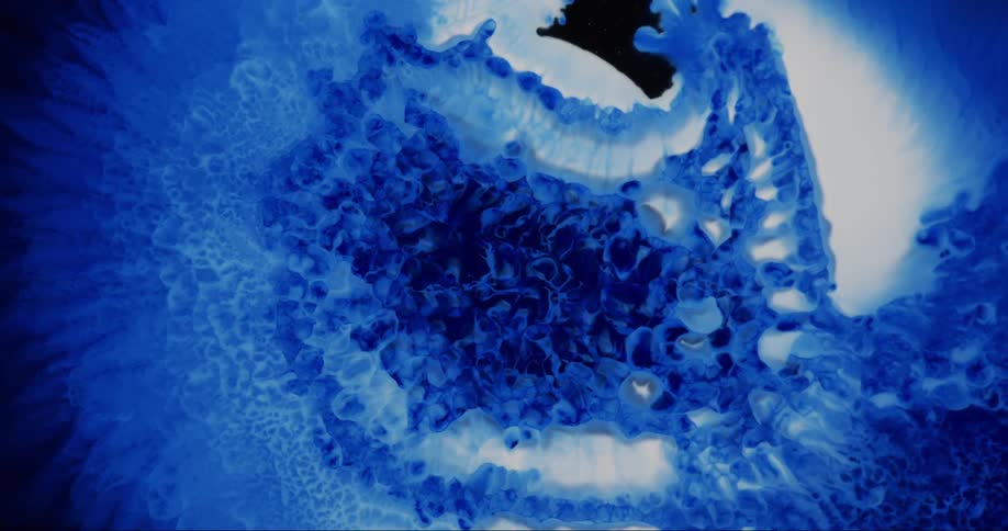 An abstract art piece features all purple colored soap bubbles and water in a circle