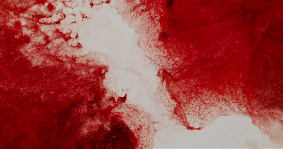 The red ink moves around in the liquid