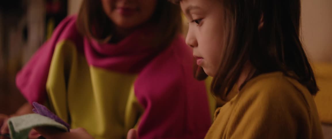 Mother and daughter doing arts and crafts with felt