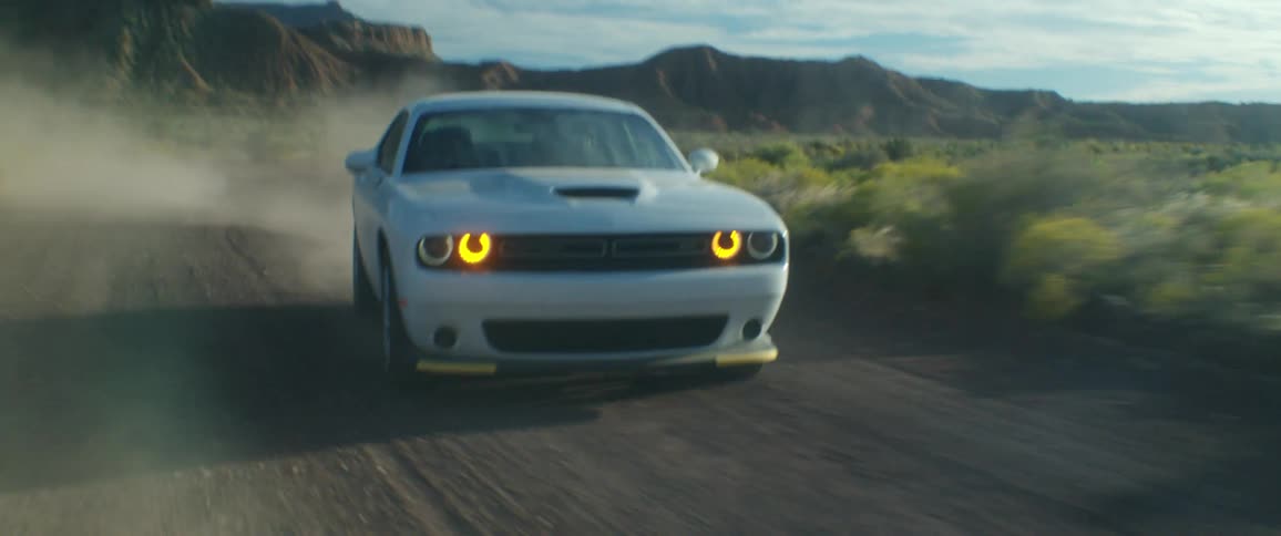 A car is drifting on the dirt road