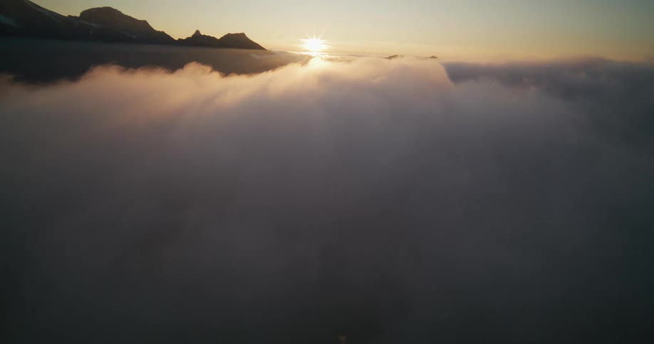 The clouds float on the peak of the mountains