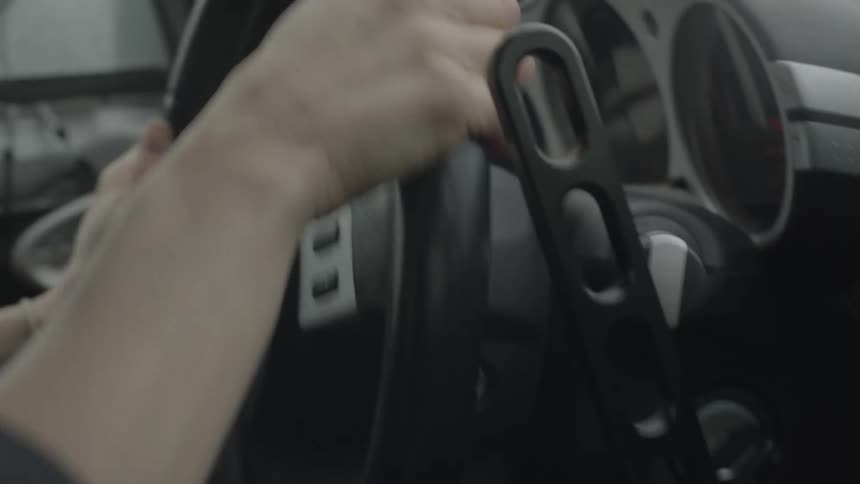 A woman steering a rally car
