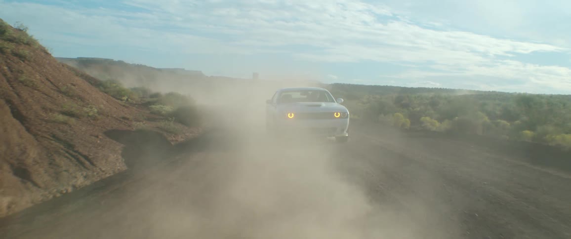 A car sliding on a road during a rally