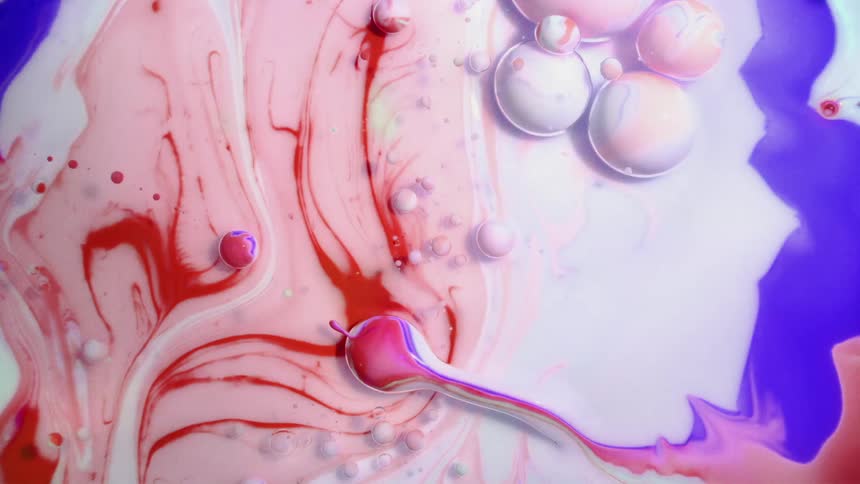 An abstract oily liquid paint is revealing bubbles