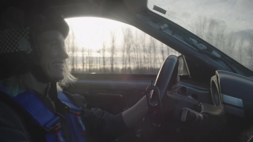 A woman driving a car in a rally