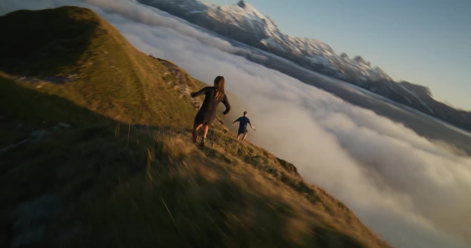 A clip of a male and female running down the hill