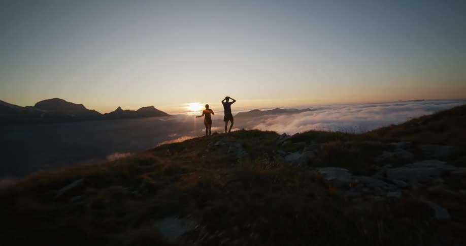 Two people at the top of a mountain